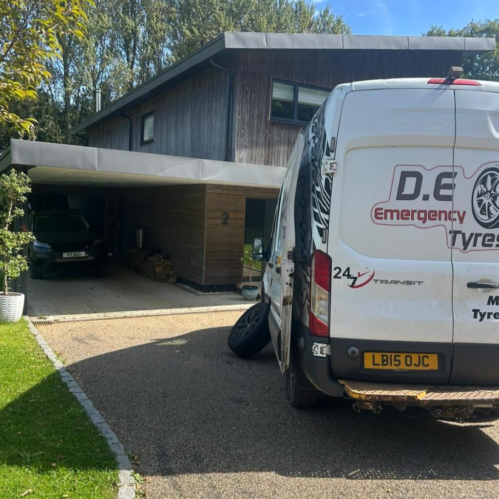 Mobile tyre fitting service at customer home driveway D.E Emergency Tyres mobile tyre fitting van parked at customer driveway for tyre replacement service